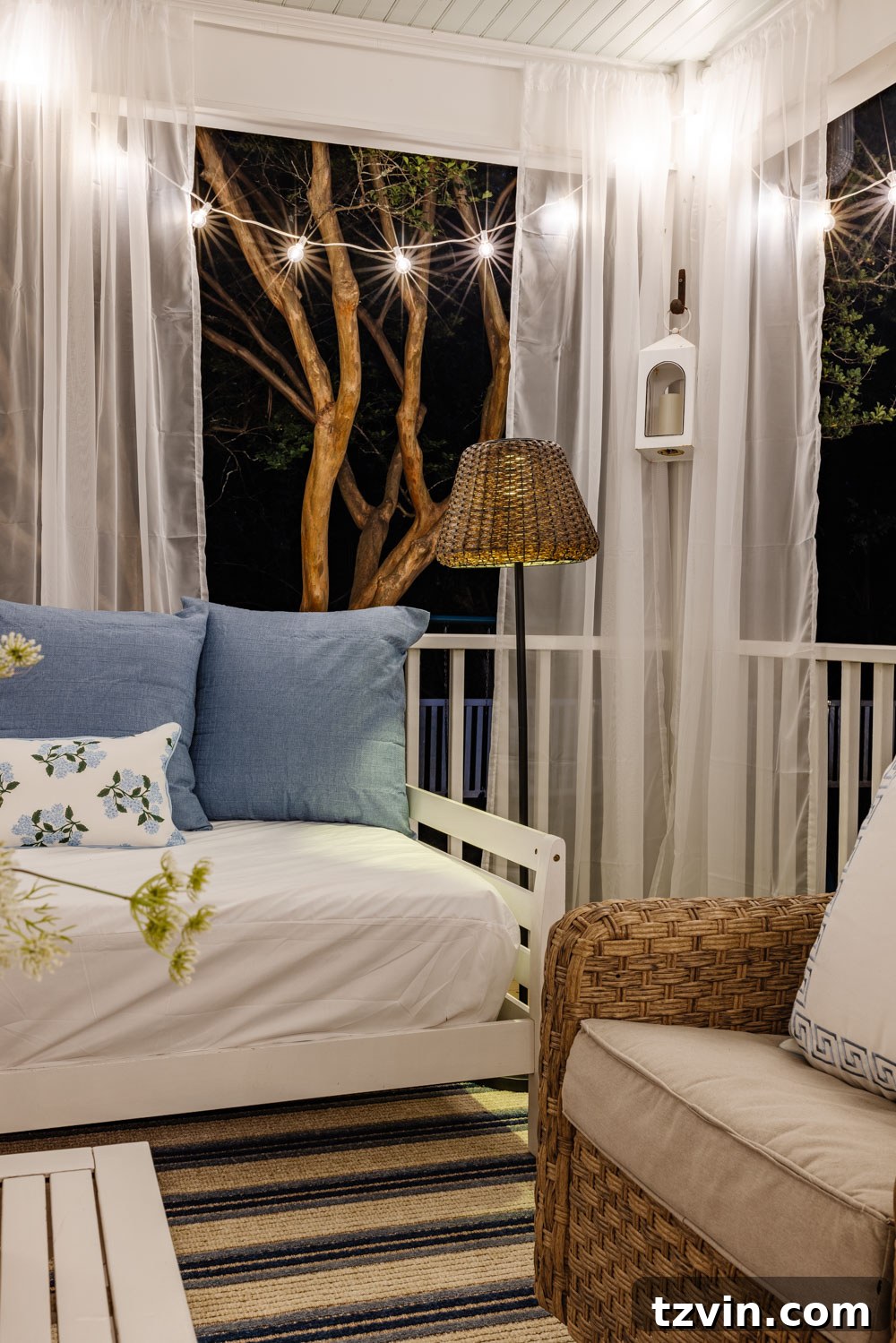 Our DIY Outdoor Living Room: Seamlessly Extending Our Home 16 Dreamy outdoor living room with sheer mosquito net curtains creating a romantic, bug-free ambiance on a back porch.