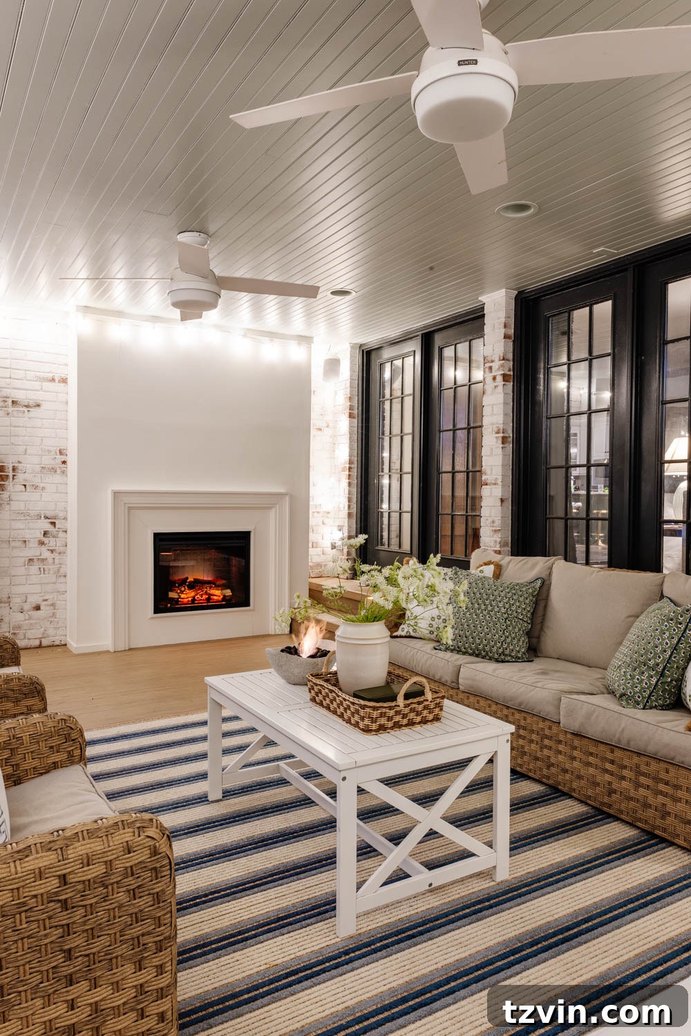Our DIY Outdoor Living Room: Seamlessly Extending Our Home 18 Inviting outdoor living room with stylish decor and a warm ambiance on a back porch.