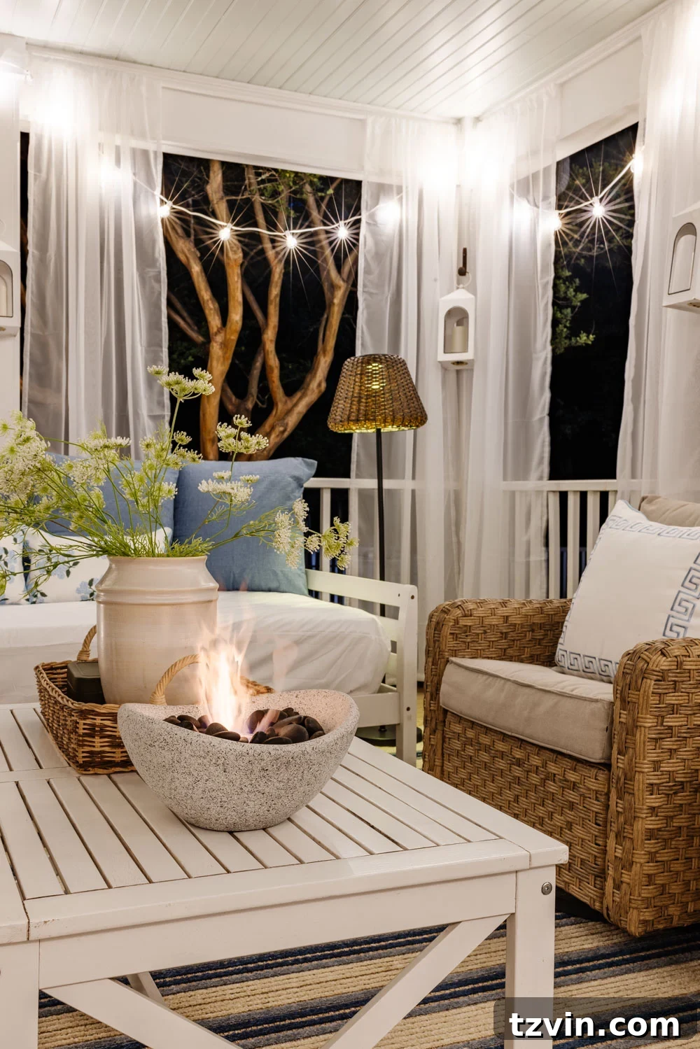 Our DIY Outdoor Living Room: Seamlessly Extending Our Home 6 Cozy outdoor living room with a view of the fireplace and stylish furniture on a back porch.