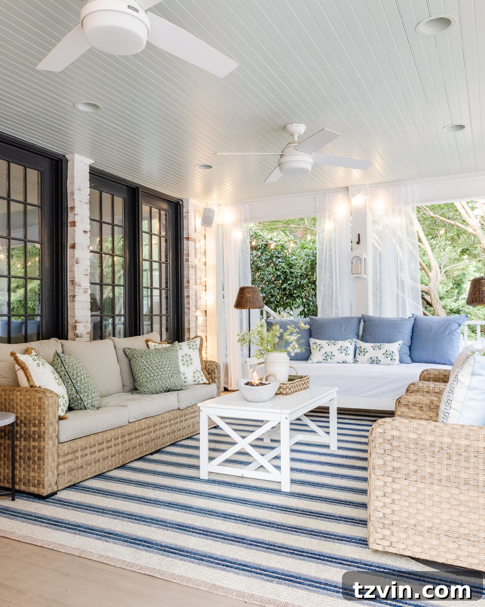 Our DIY Outdoor Living Room: Seamlessly Extending Our Home 7 Outdoor living room showcasing a limewashed brick fireplace and elegant furniture on a back porch.