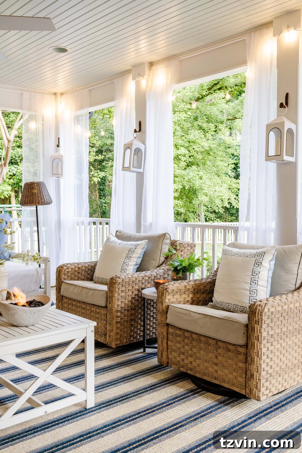 Our DIY Outdoor Living Room: Seamlessly Extending Our Home 10 Elegant rattan patio furniture arranged around a fireplace in an outdoor living room setting.