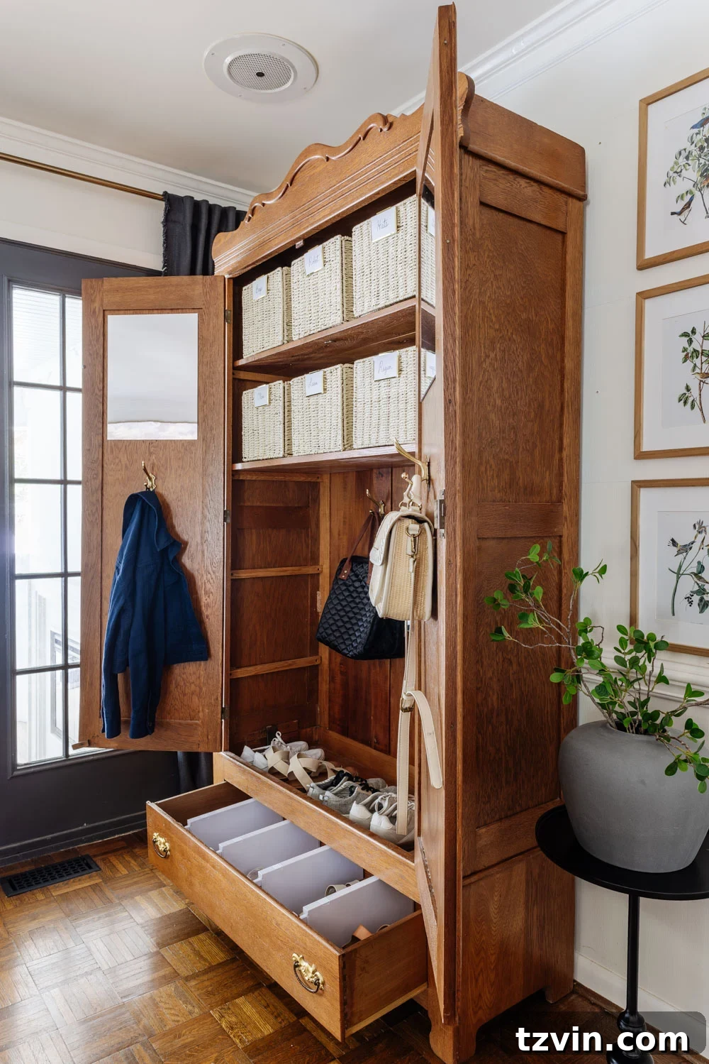 armoire coat closet in an entryway for storage without a mudroom