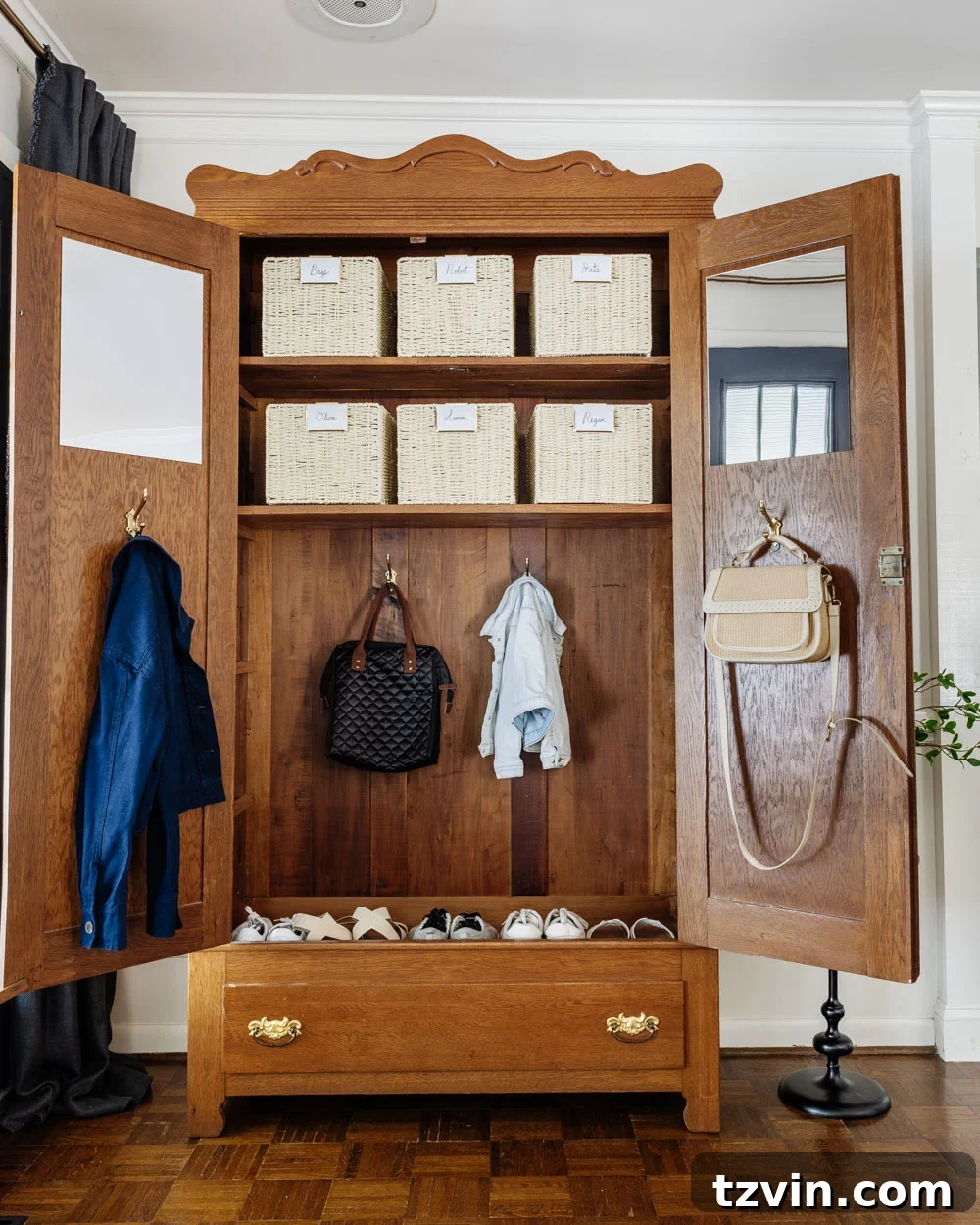 armoire coat closet in an entryway for storage without a mudroom