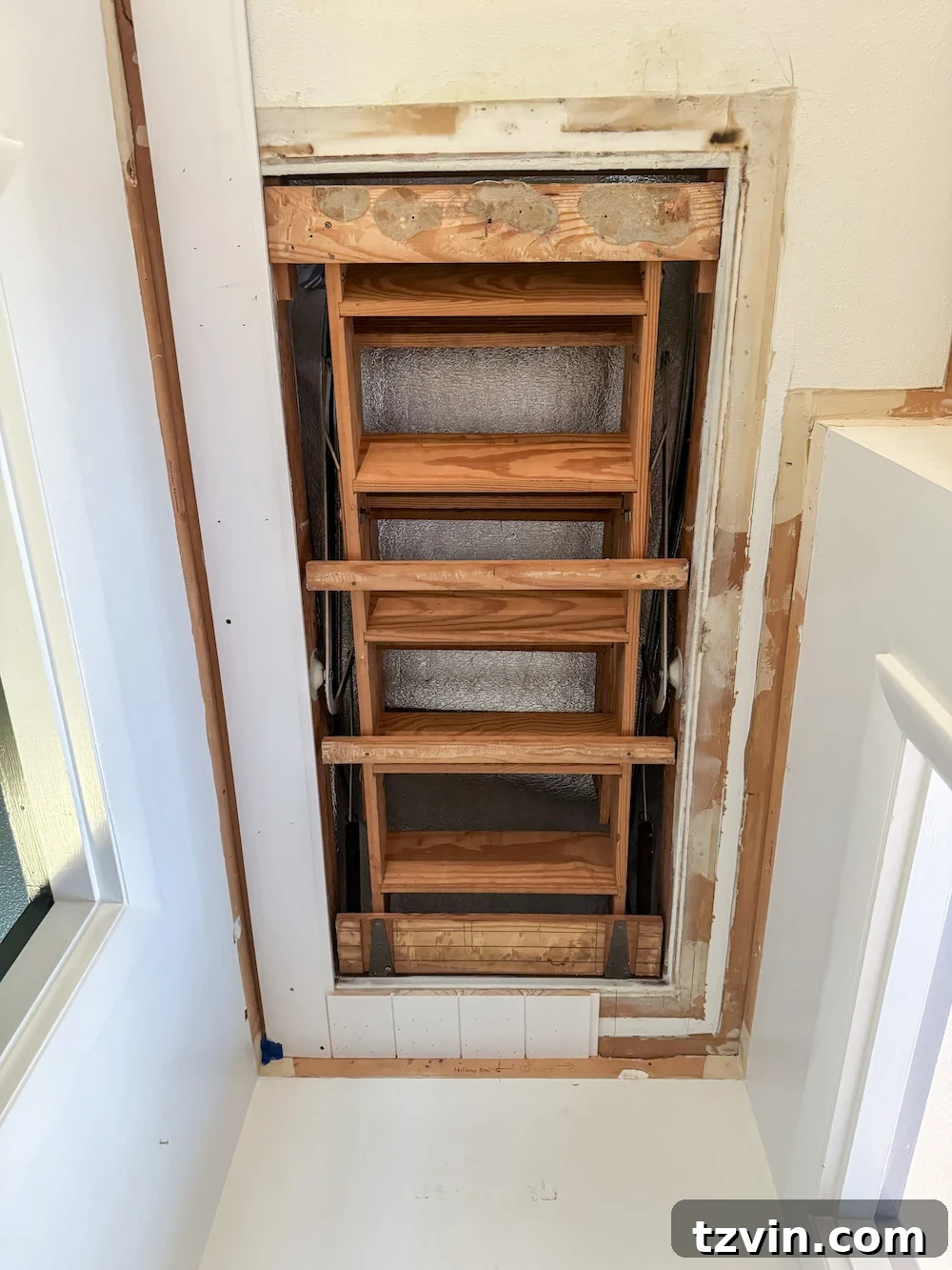 hide attic door with shiplap planks