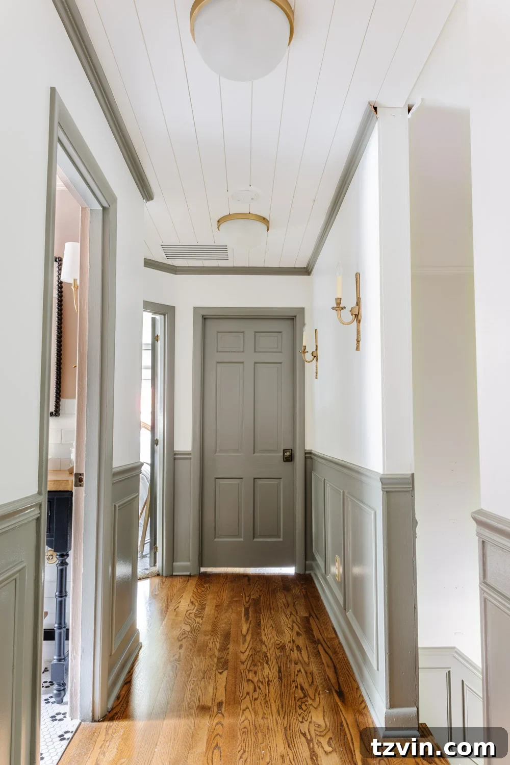 Stop Your Painted Door From Sticking 2 painted doors and wainscoting in a hallway with Sherwin Williams Willowleaf