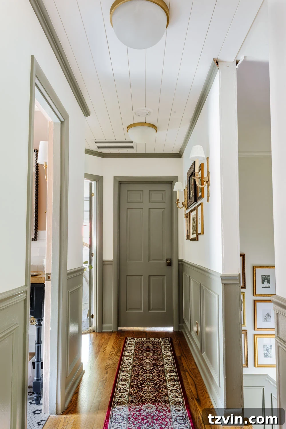Design Hacks for Expansive Hallways 5 Decorated narrow hallway with green wainscoting and a gallery wall