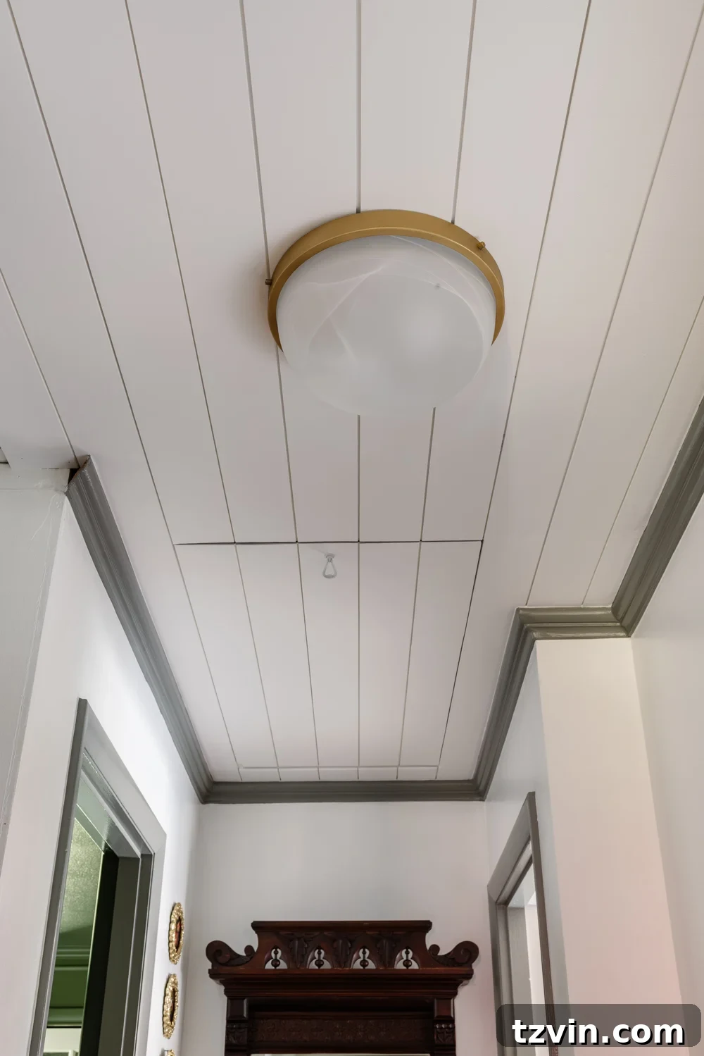 tongue and groove ceiling with hidden attic door