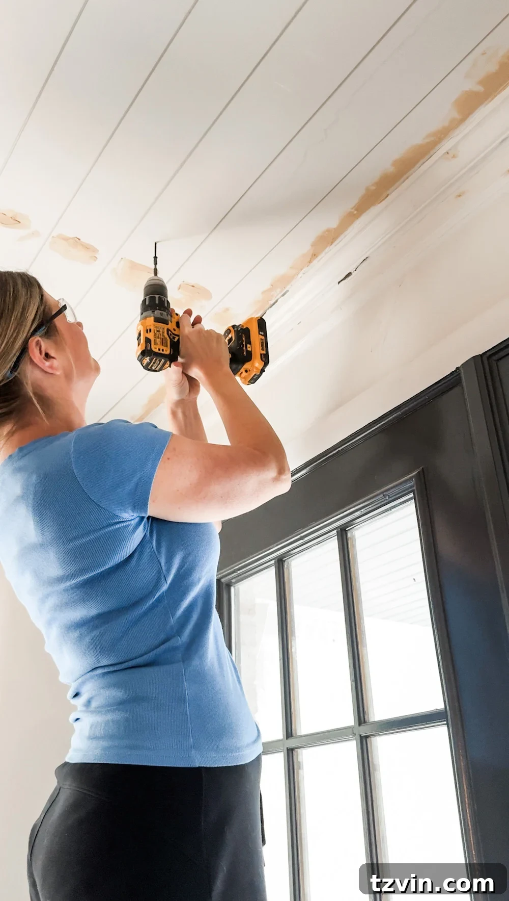 DIY Shiplap Ceiling and Crown Molding Makeover 9 DIY shiplap ceiling installation nearing completion