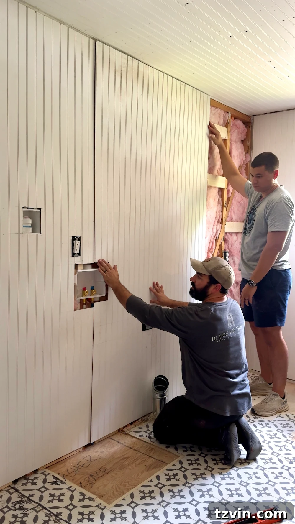 Applying construction adhesive and installing beadboard panels