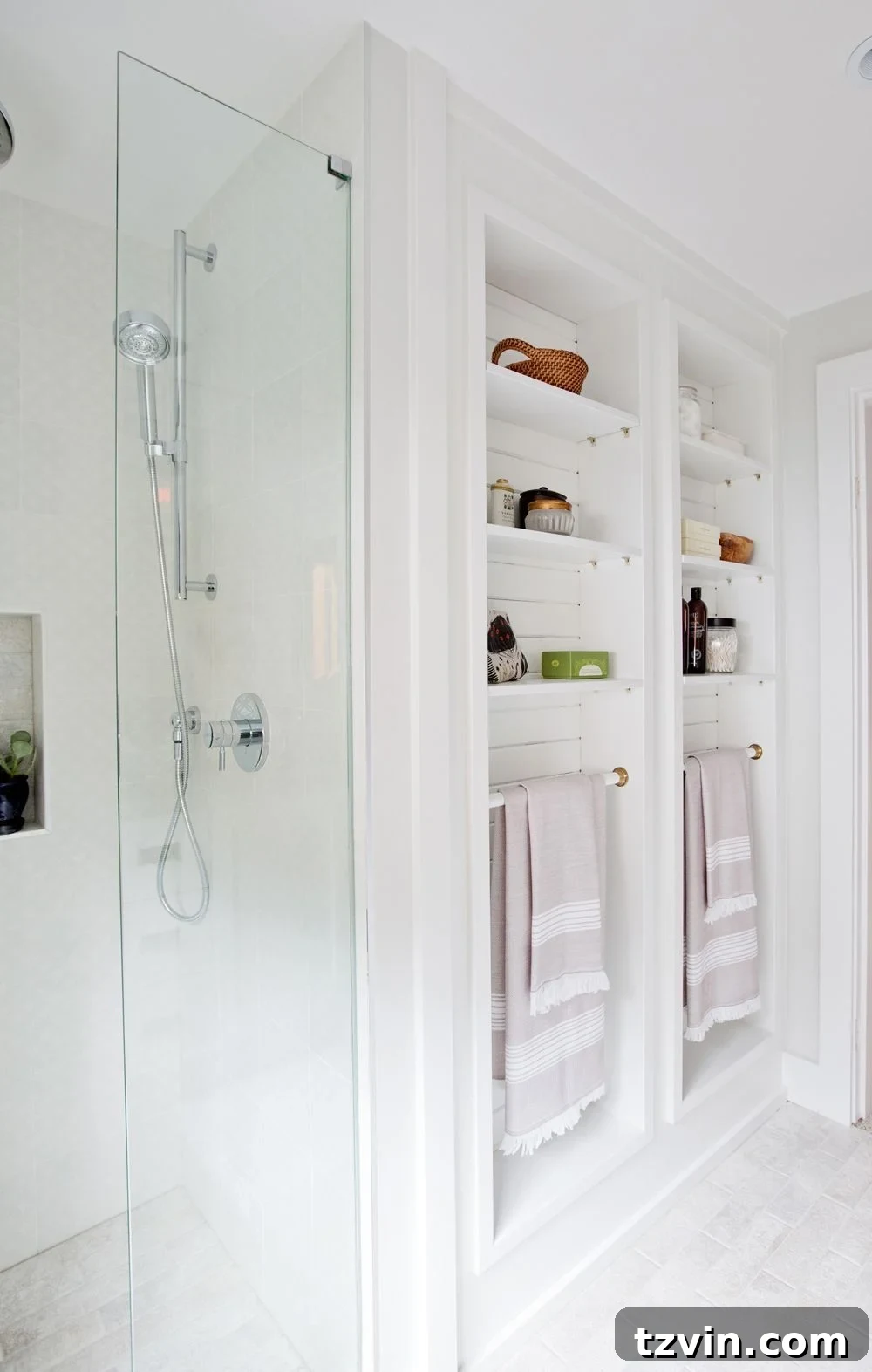 Recessed towel bars built into a wall for drying towels without obstructing traffic.