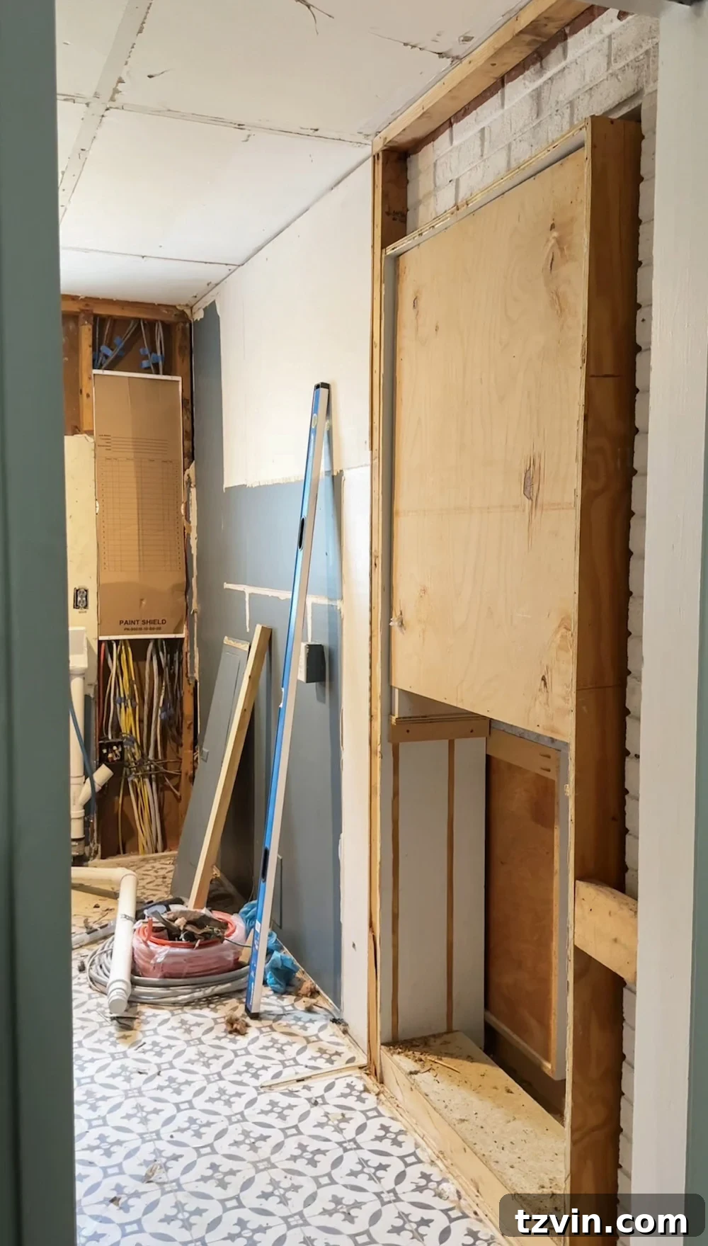 Hidden doorway discovered behind a wall panel, perfect for recessed storage.