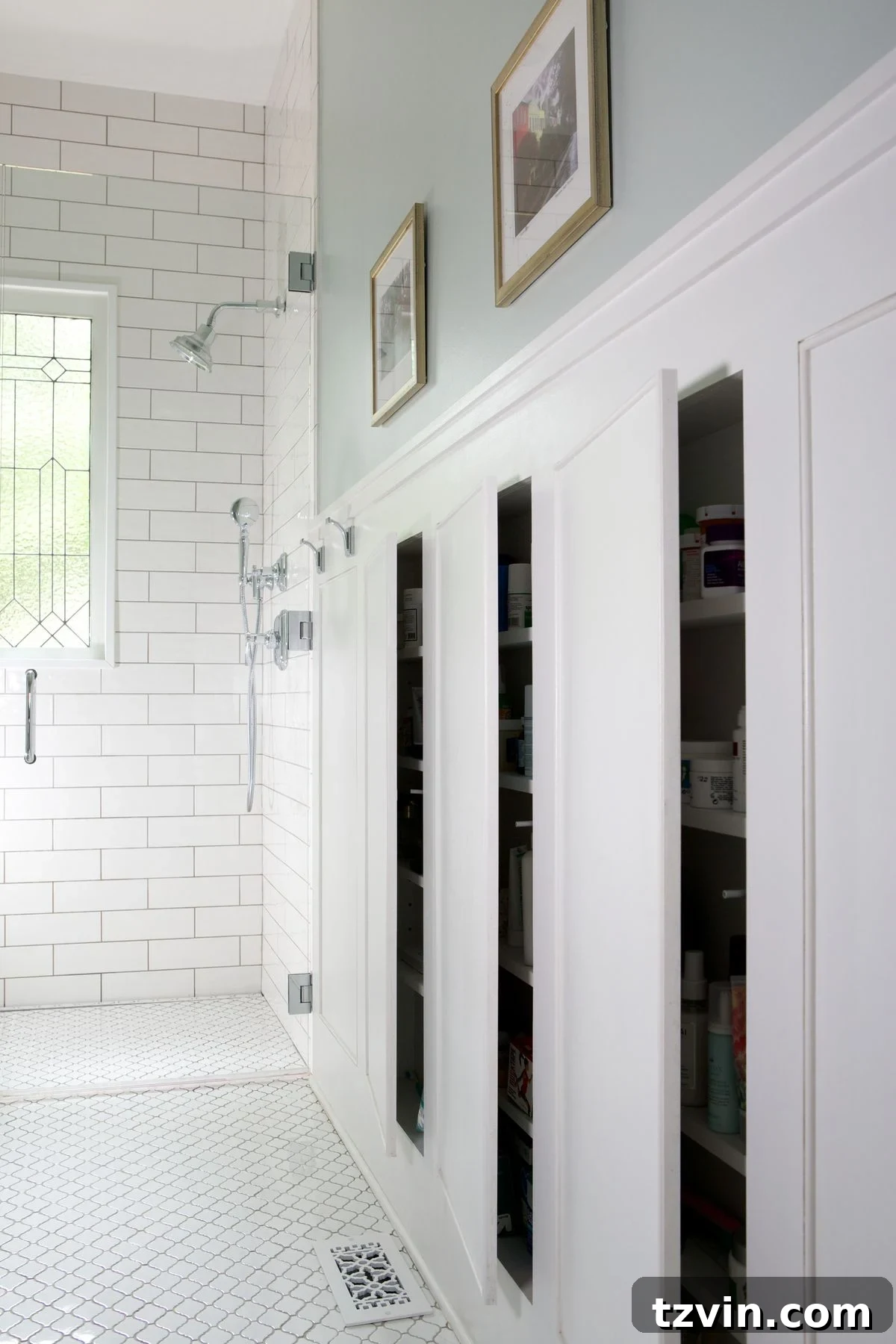 Hidden cabinets built into wainscoting between studs, blending seamlessly with the wall.