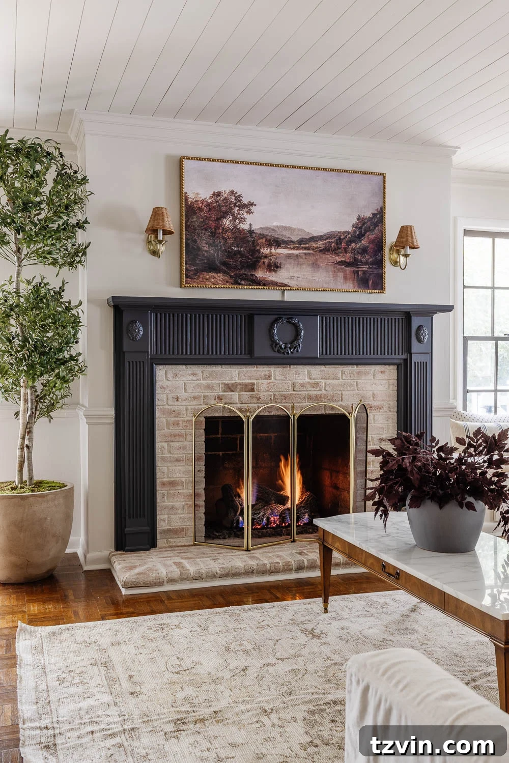 A beautifully decorated living room featuring cohesive elements and a calm color palette.
