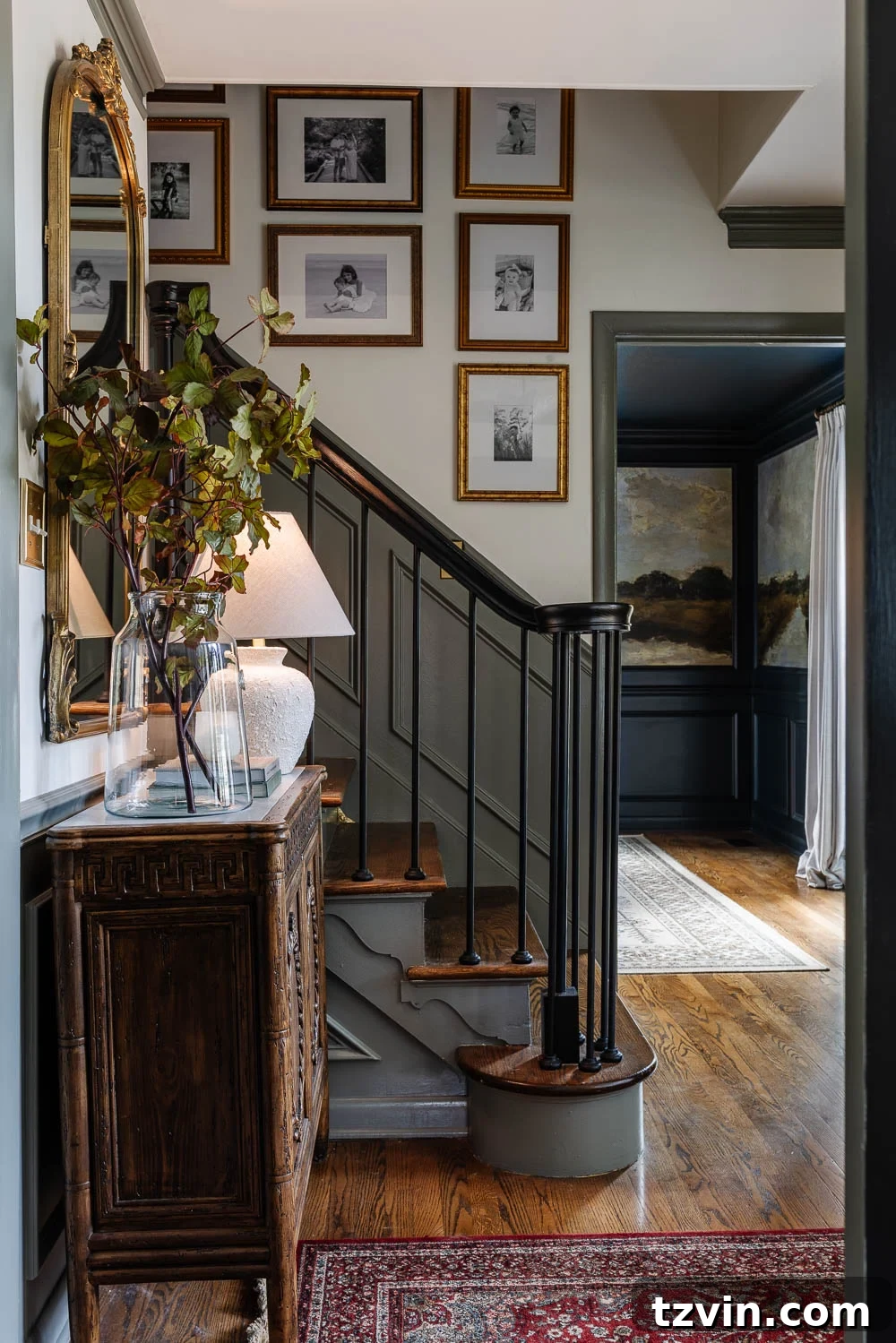 A stylish foyer featuring consistent color scheme and decor with the rest of the house.