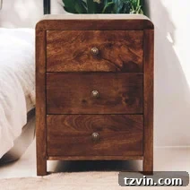 Tiny Bedroom Solutions: 20+ Space-Saving Nightstands 19 White glossy slim nightstand with a round base, featuring a unique and modern design for small bedrooms.
