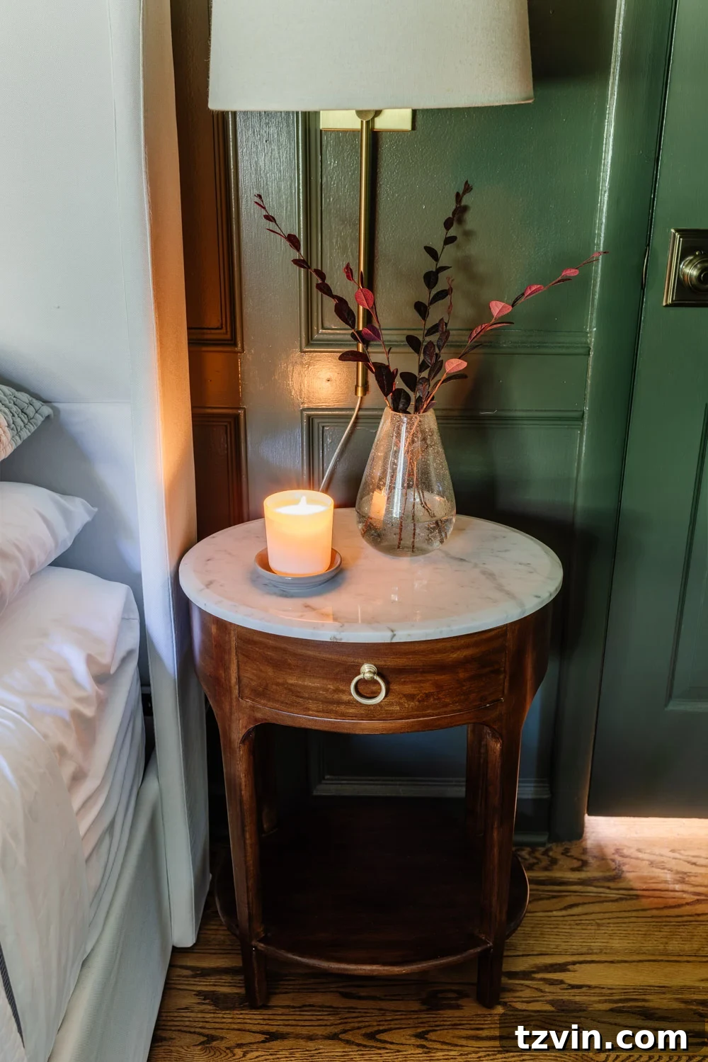 Tiny Bedroom Solutions: 20+ Space-Saving Nightstands 4 Close-up of a stylish narrow nightstand in a small bedroom, highlighting thoughtful decor and space utilization.
