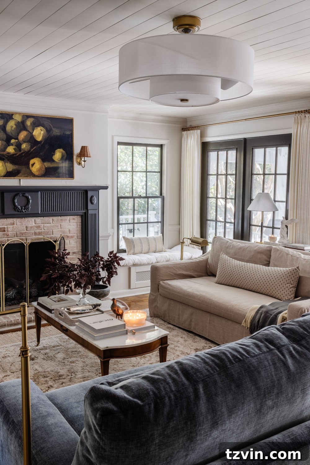 The Living Room Chronicles: An Eight-Year Design Evolution 11 living room with blue fireplace mantel, marble coffee table, and modern fandelier