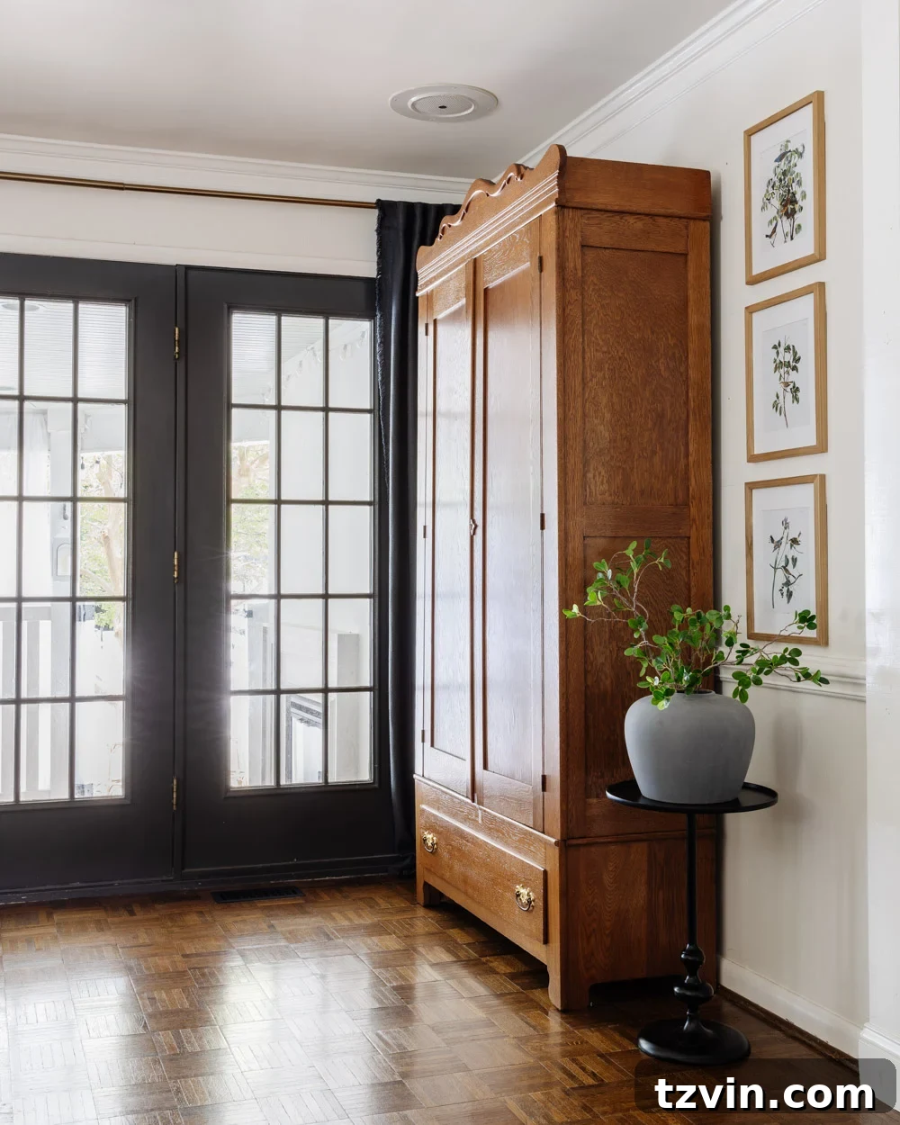 The Living Room Chronicles: An Eight-Year Design Evolution 9 armoire coat closet in an entryway for storage without a mudroom