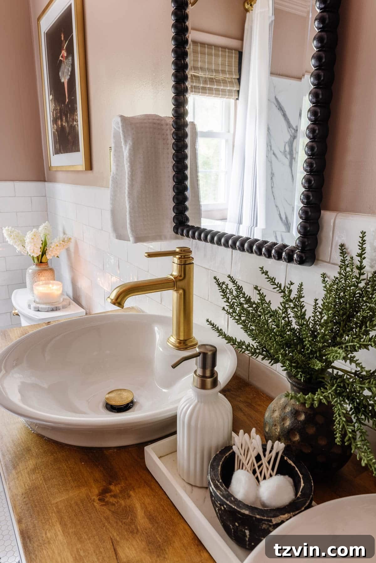 Vessel sink with gold faucet on console table bathroom vanity
