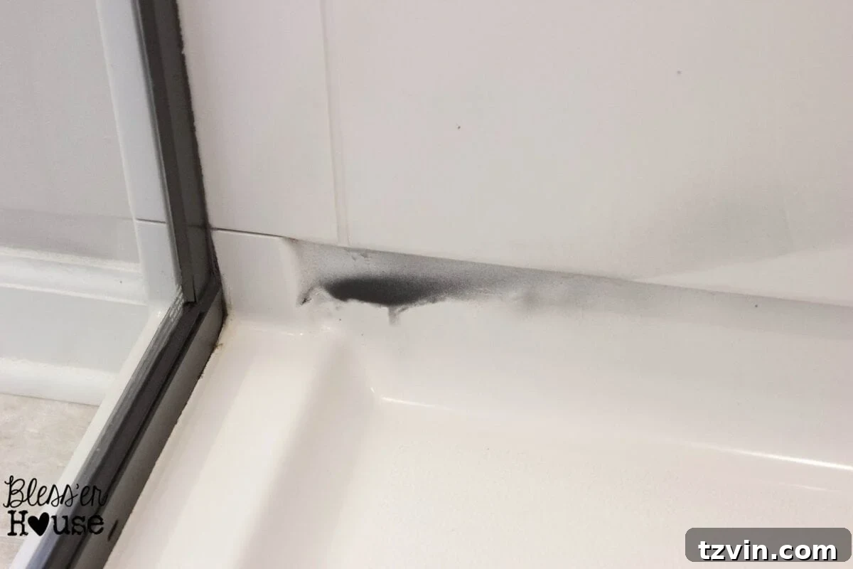 Spray paint overspray on tile and plastic, indicating insufficient protection