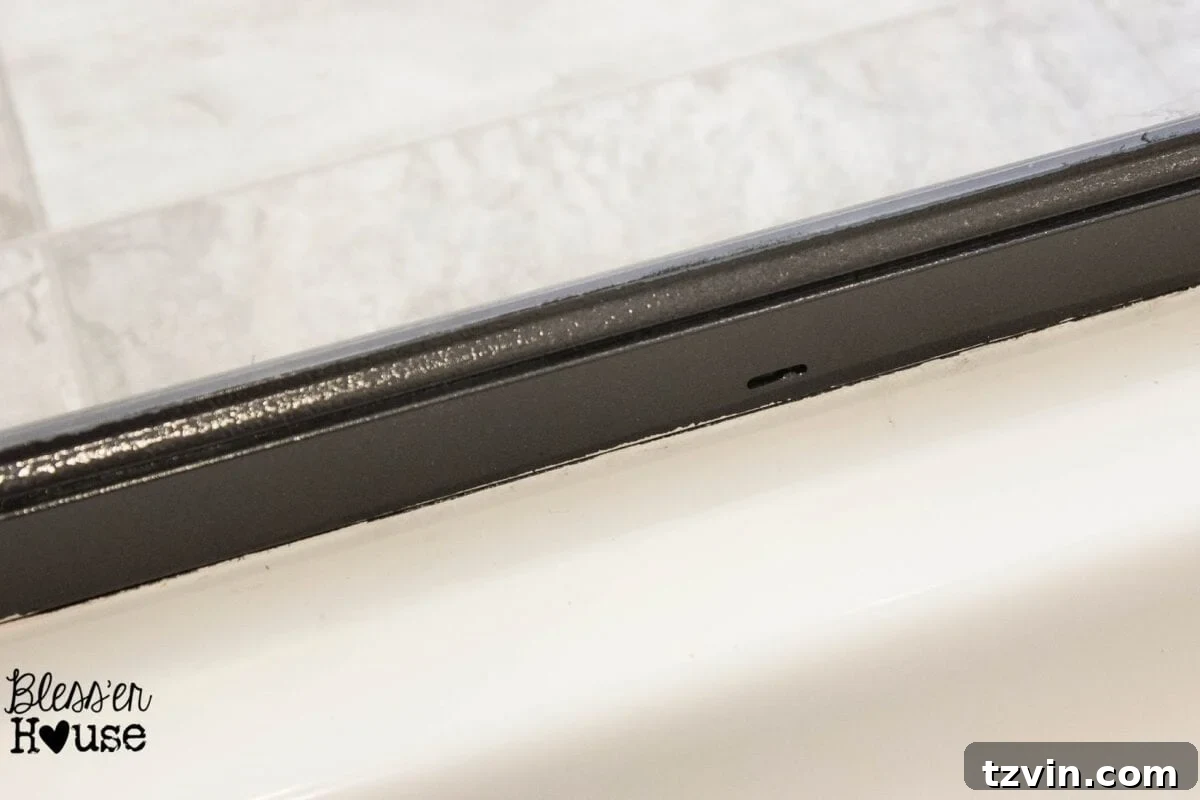 Clean, crisp spray painted edge after fixing paint bleed with nail polish remover and a razor blade