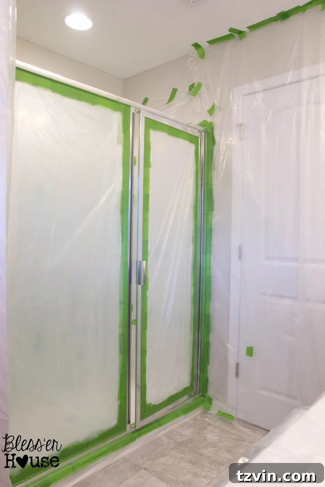 Shower frame meticulously taped off with Frog Tape for spray painting