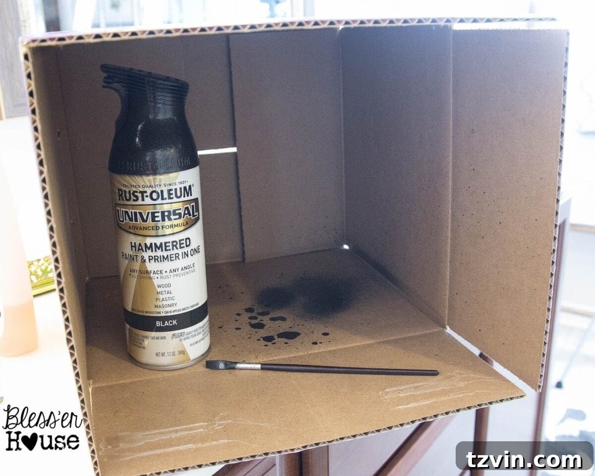 Artist brush being used to touch up peeled spray paint on a shower door frame