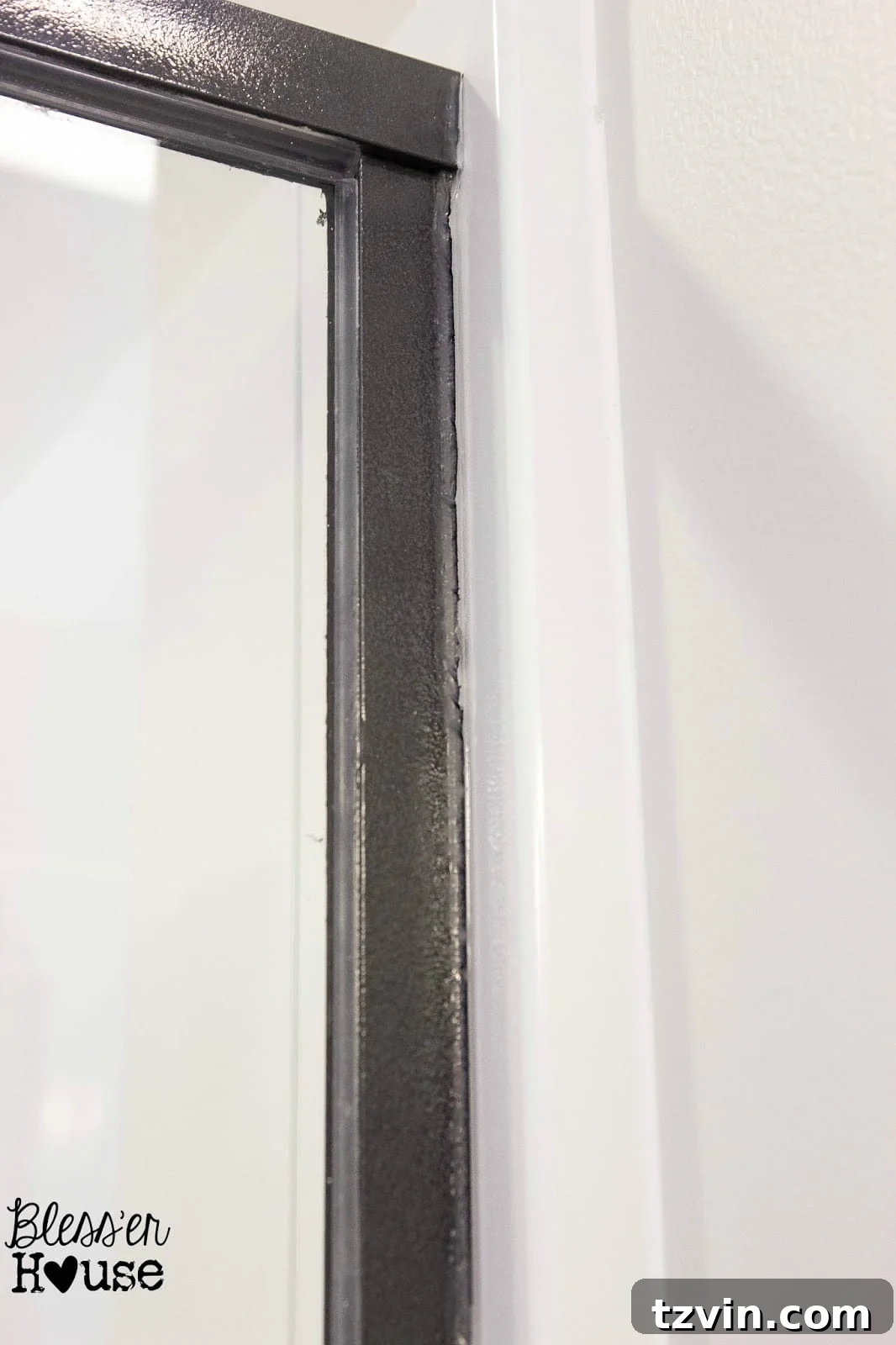 Finished spray painted shower door frame, looking much improved after fixing mistakes
