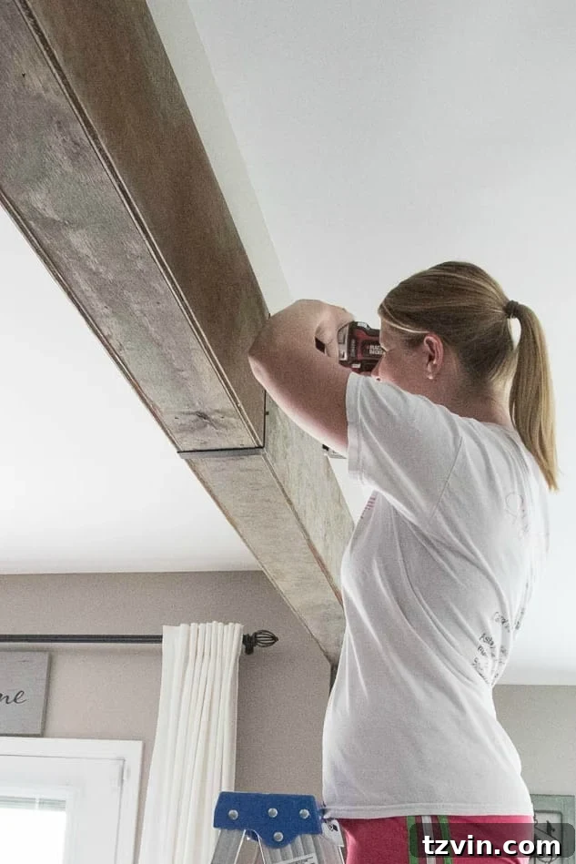 DIY wood beam doorway with aged wood stain