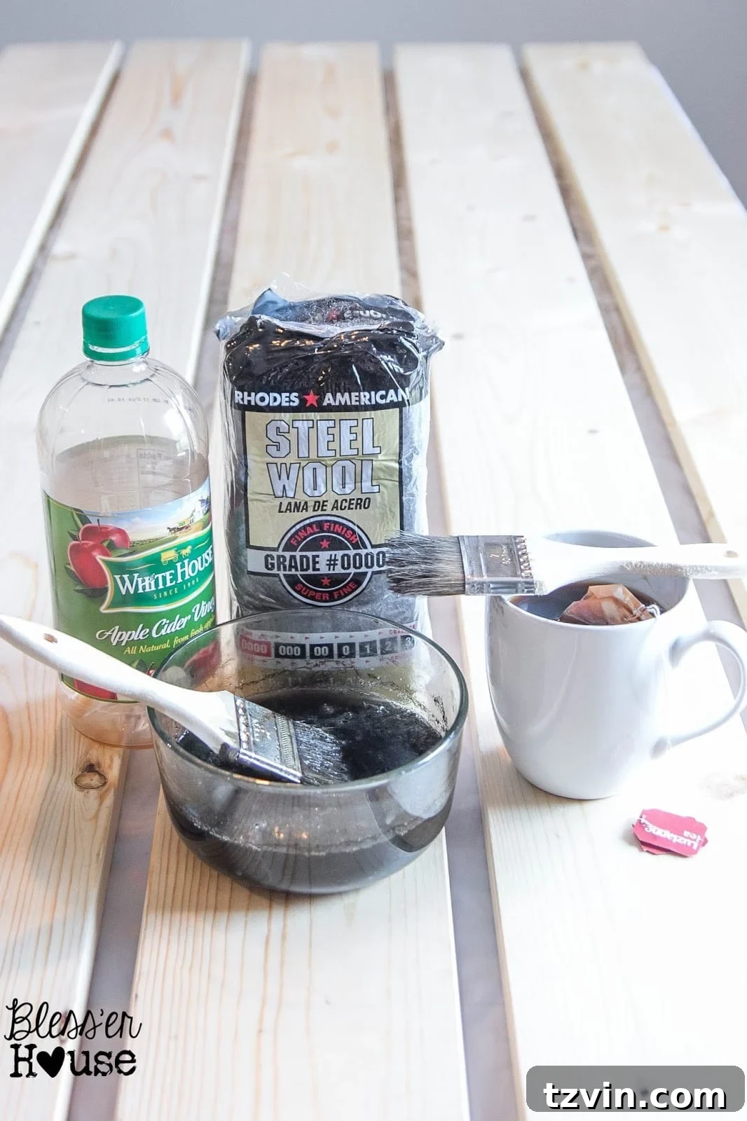 The ingredients you need for this DIY all natural wood stain method are steel wool pads, some black tea, apple cider vinegar and a few paint brushes. 