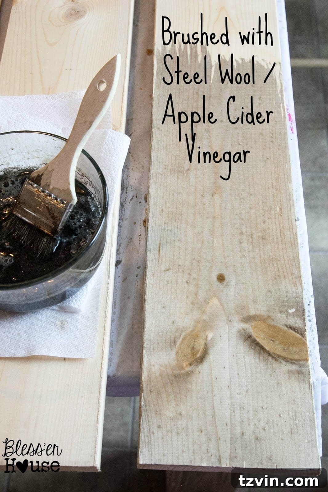 The next step in this all natural wood stain method is to brush the tea stained lumber with the steel wool and apple cider vinegar stain. 