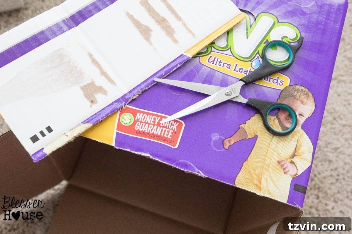 A stack of empty cardboard diaper boxes with their tops removed, ready for crafting into pantry crates.