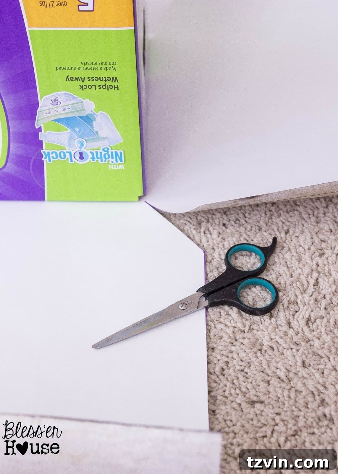 The faux wood craft paper with diagonal cuts at the corners, creating flaps for wrapping neatly around a box.