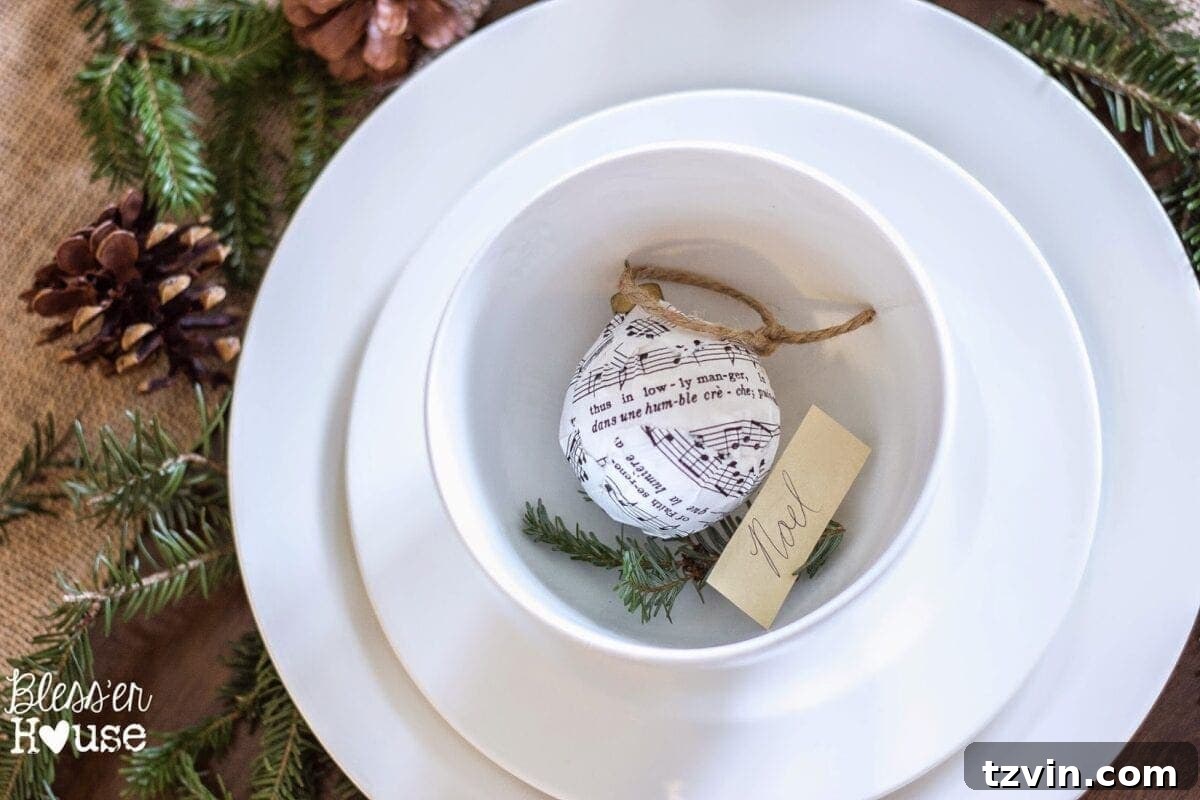 Festive Christmas Decor That Won't Break the Bank 7 Christmas ornaments decoupaged with old sheet music using Mod Podge, showcasing a DIY transformation