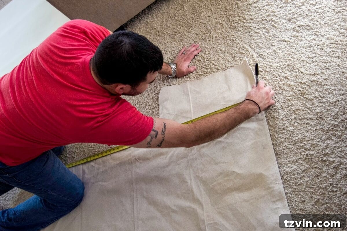 Measuring and marking drop cloth fabric for chair upholstery