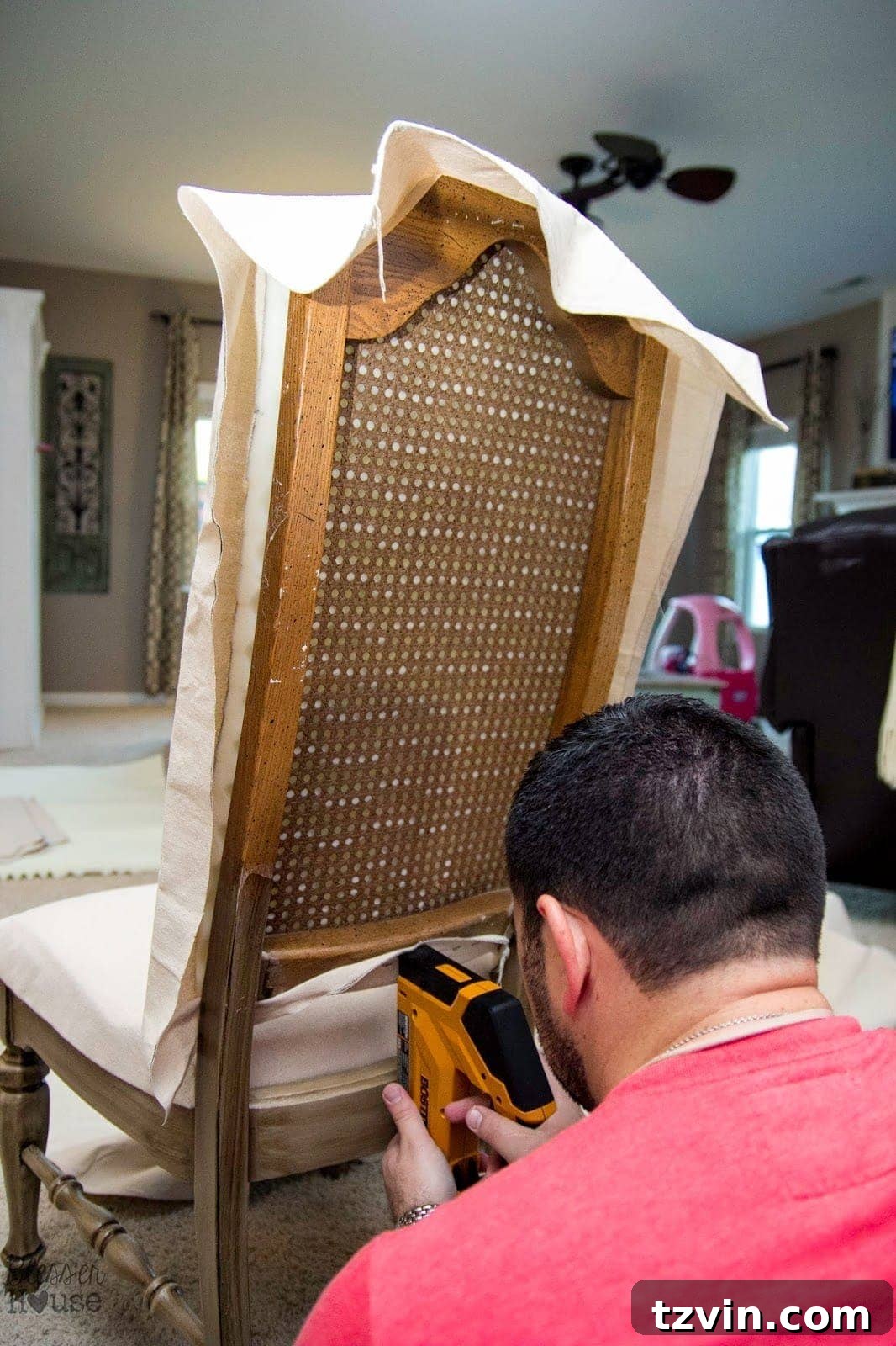 Stapling the bottom center of the chair fabric