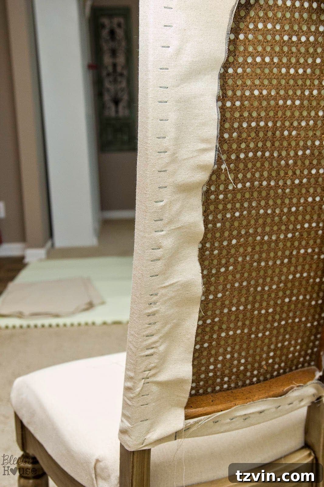 Close-up of tightly stapled fabric on the side of the chair
