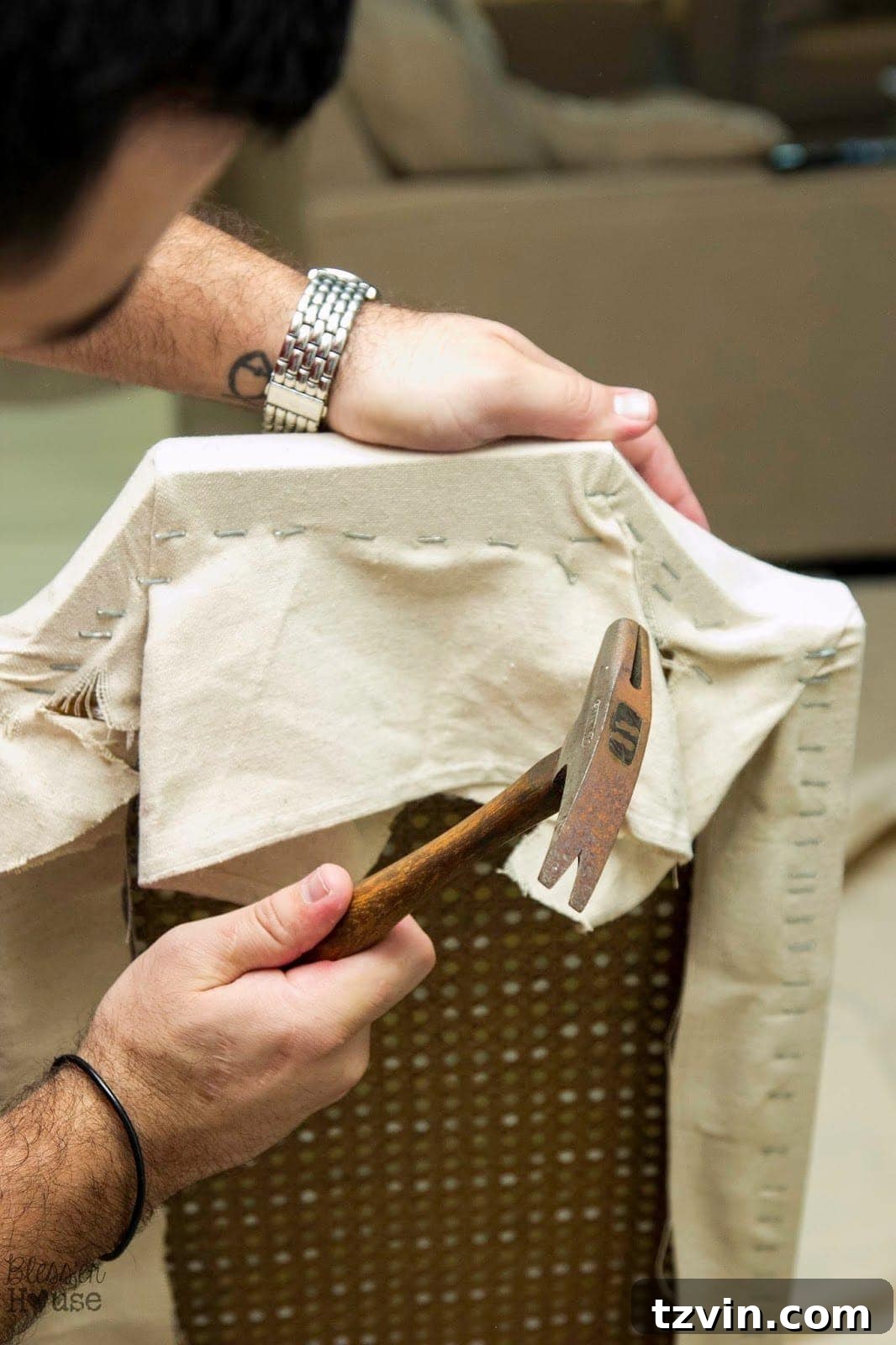 Trimming excess fabric from the back of the chair