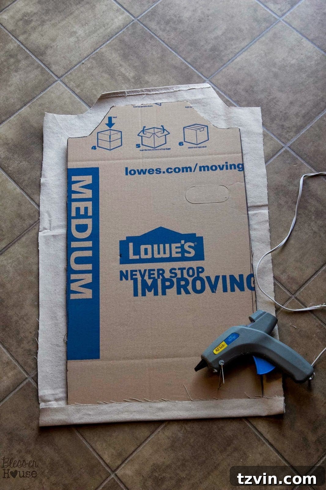 Hot gluing fabric to the back panel cardboard template