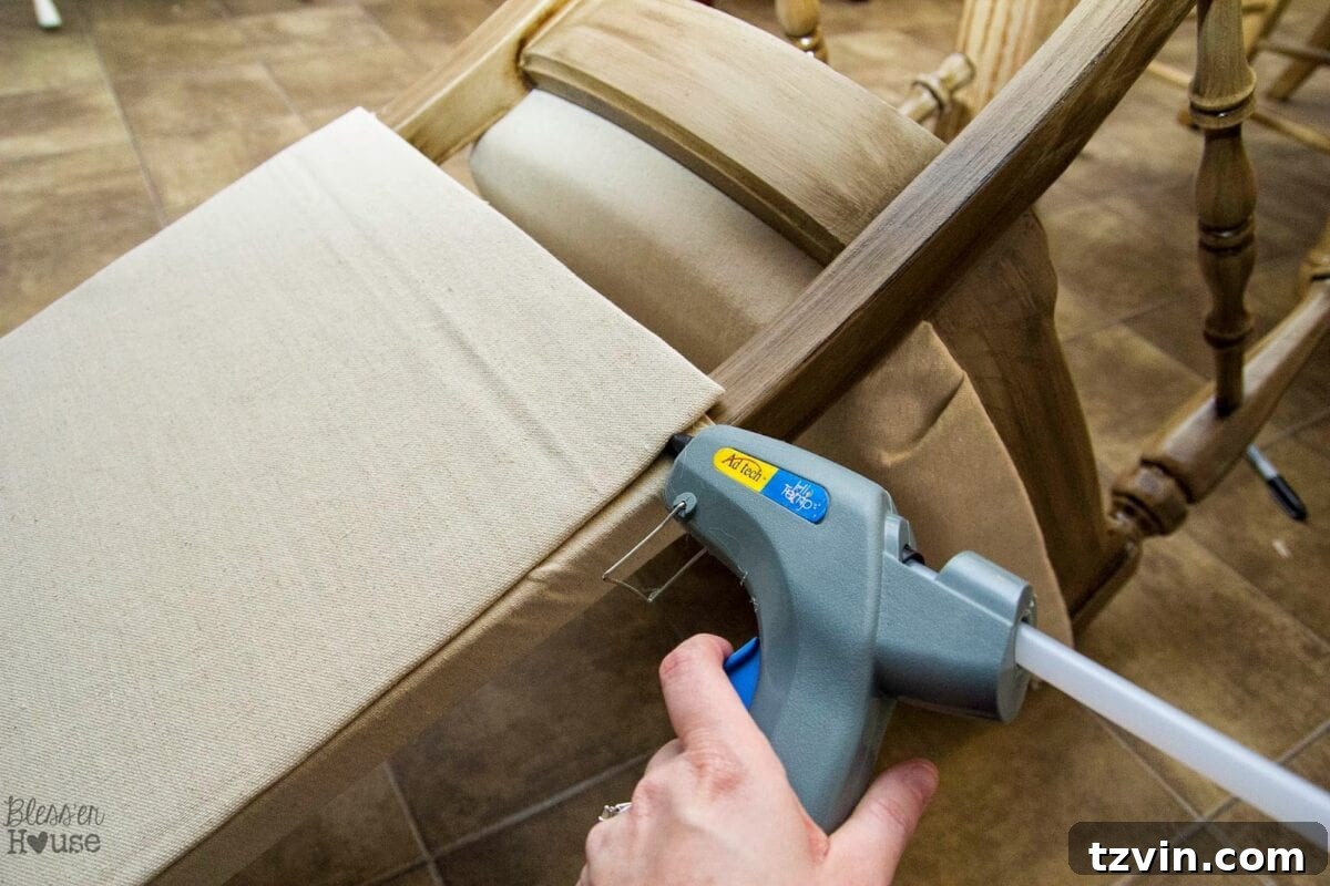 Attaching the upholstered back panel to the dining chair