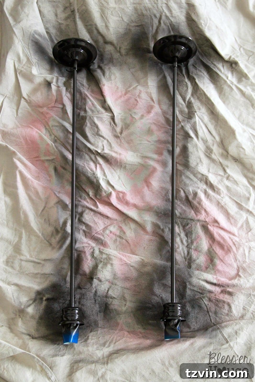 Spraying the downrods for a consistent finish