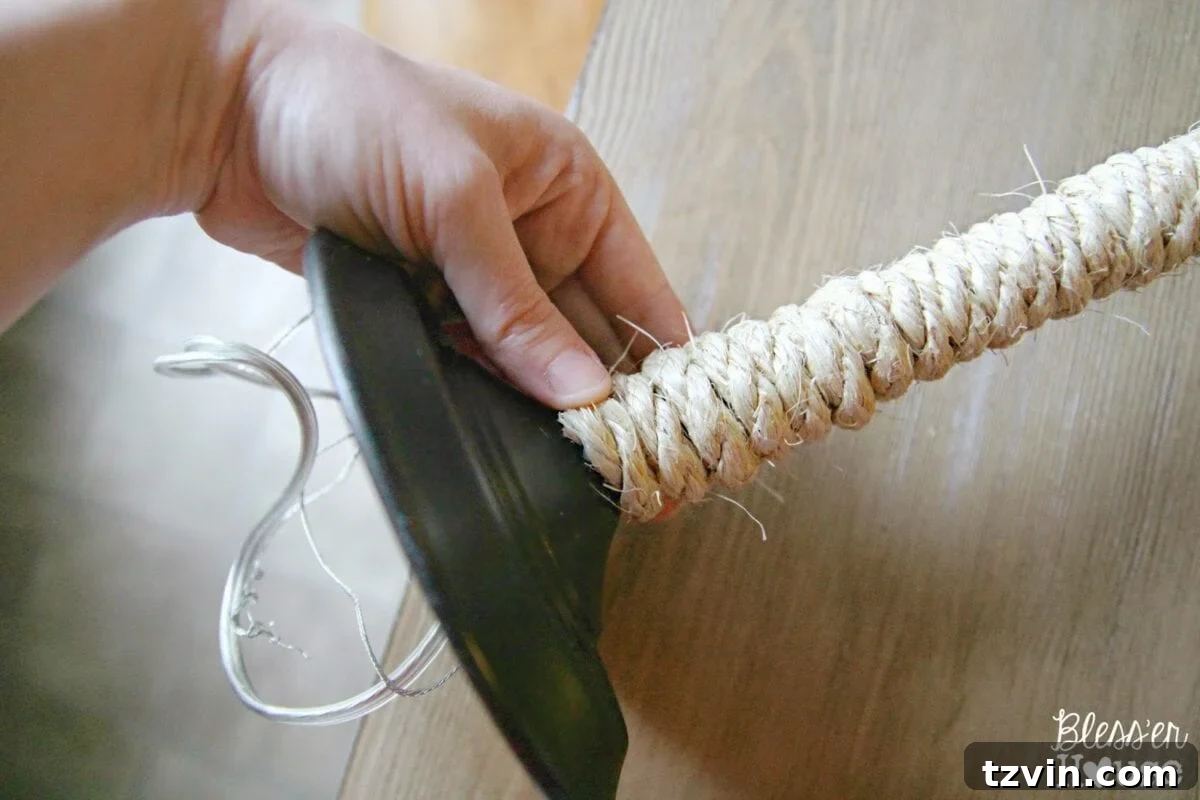 Securing the end of the sisal rope with hot glue