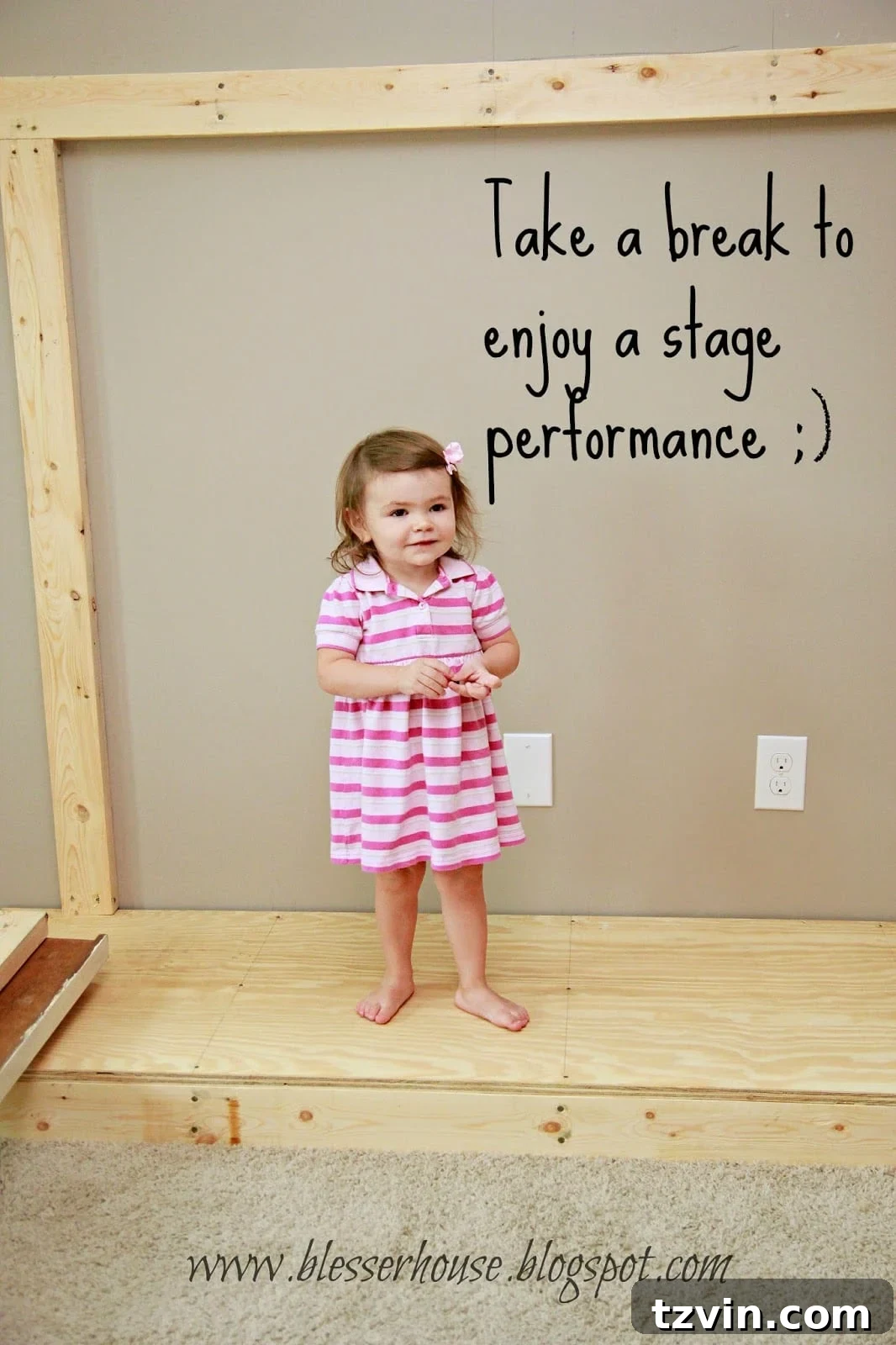 Toddler playing on the newly built hearth, acting as a stage