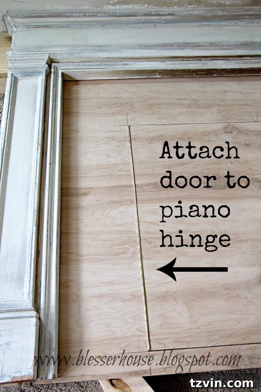 The perfectly fitting firebox door attached with a piano hinge