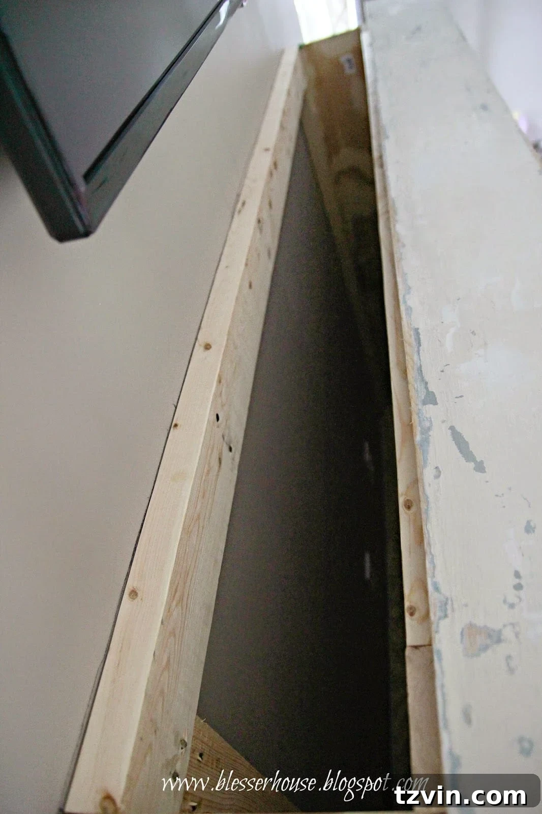 Top view of the faux fireplace structure with plywood side pieces installed