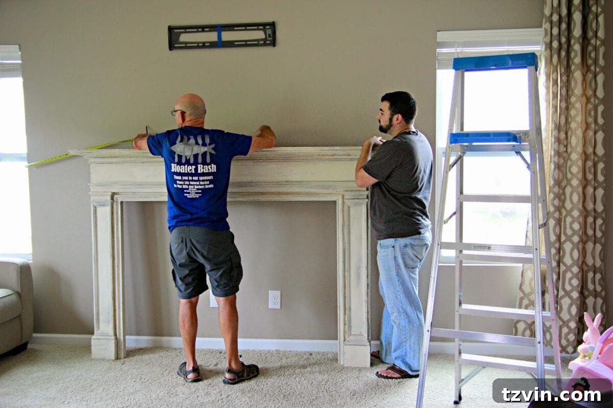Measuring and marking the wall for the faux fireplace installation