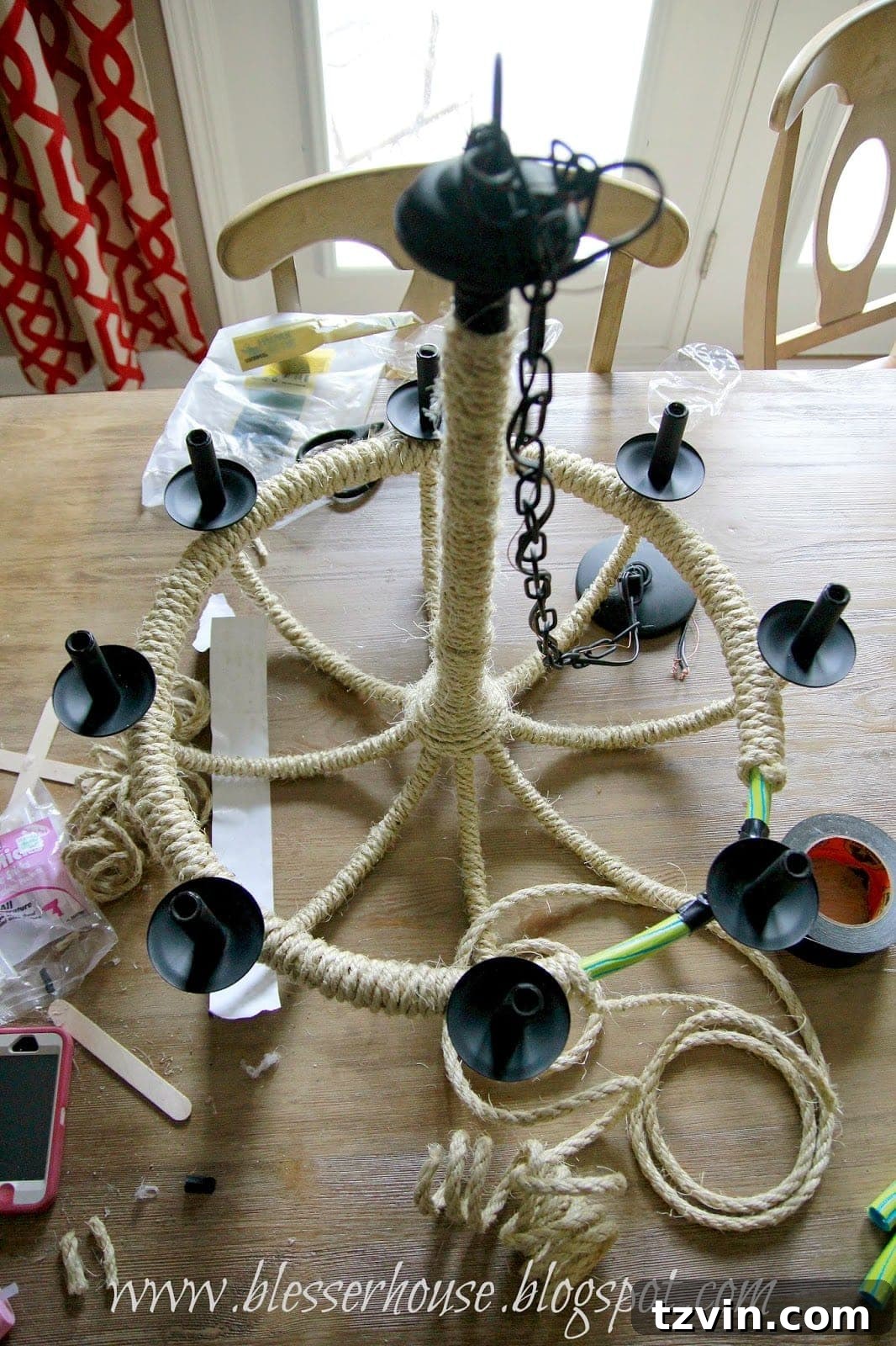 Chandelier with rope-wrapped arms and integrated hula hoop
