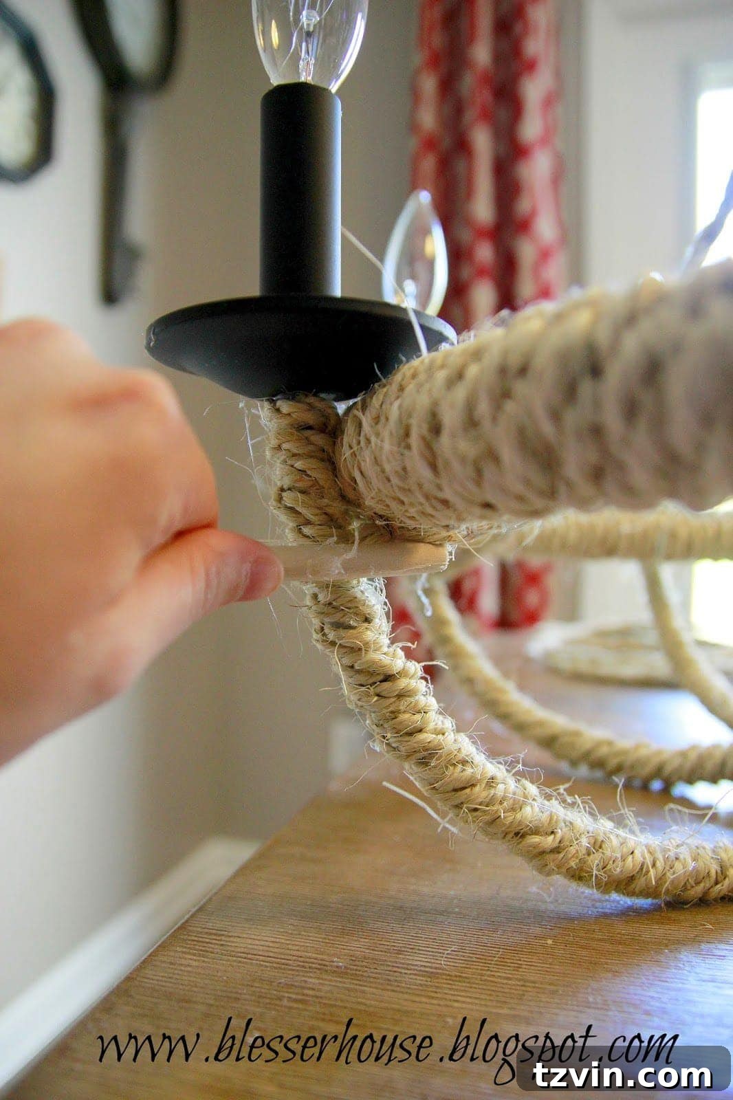 Attaching a rope swag to the bottom of the hula hoop below a light