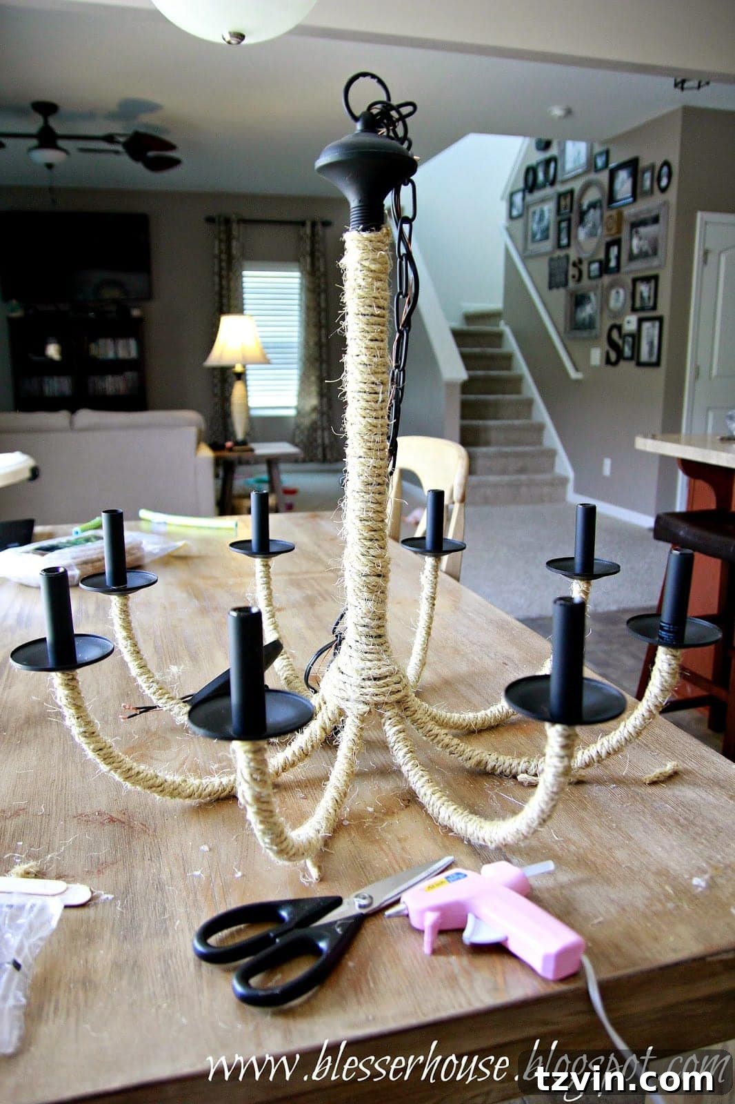 Hula hoop being wrapped with thicker sisal rope