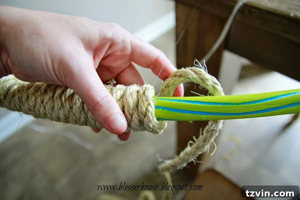 Close-up of the hula hoop being wrapped with rope
